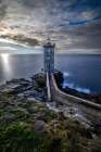 France-Brittany-Le Conquet Sun setting at the Kermorvan Lighthouse Art Print